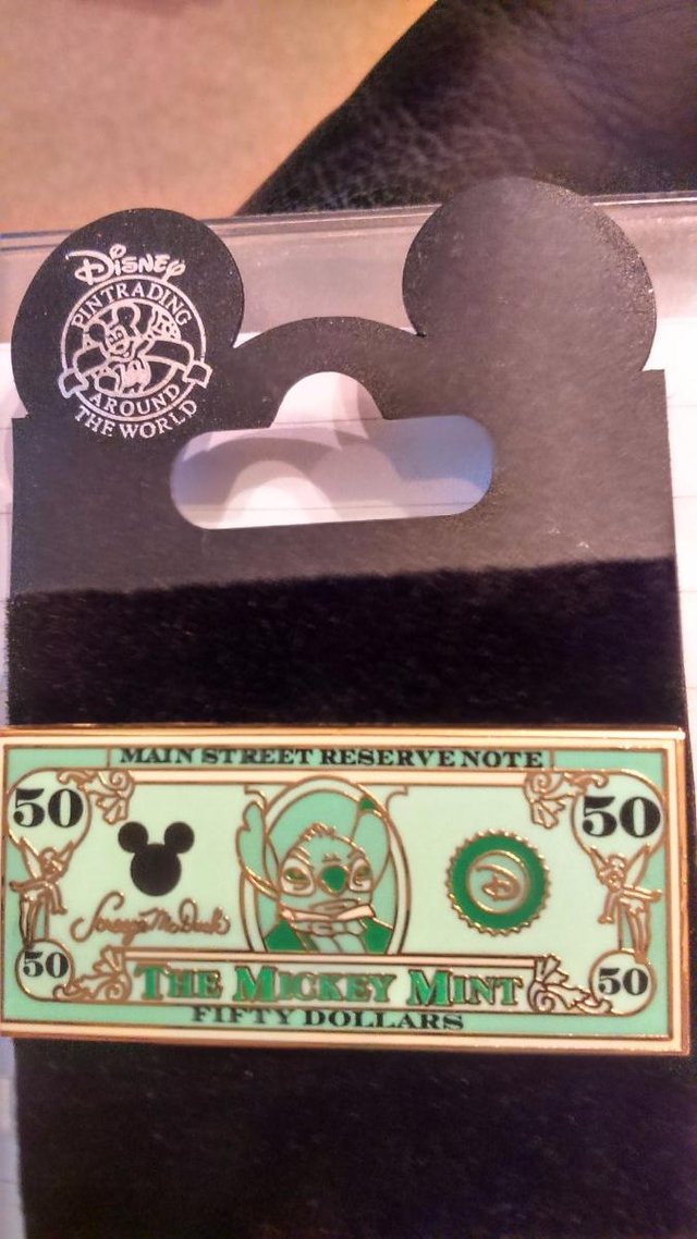 Preview of the first image of The Mickey Mint Fifty Dollar Pin Badge.
