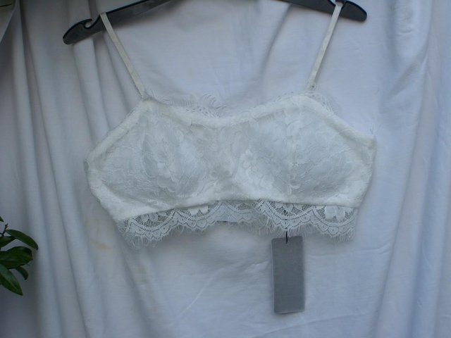 Preview of the first image of Cute ISASSY White Lace Bra Top – Size 8-10 - NEW.