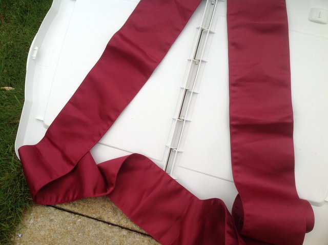 Preview of the first image of Wedding - wine / claret satin chair sashes.