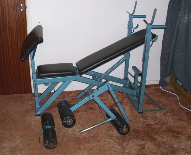 Preview of the first image of Weightlifting Bench with arm rest and leg curl attachments.