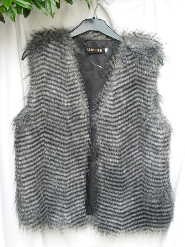 Preview of the first image of LANSHIFEI Fake Fur Body Warmer Top – Size 10 NEW.