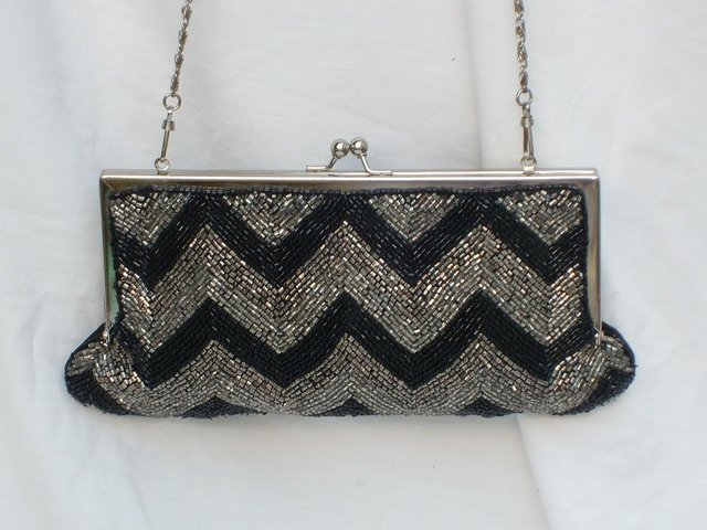 Preview of the first image of M&S Black & Silver Zigzag Beaded Handbag/Clutch - NEW.