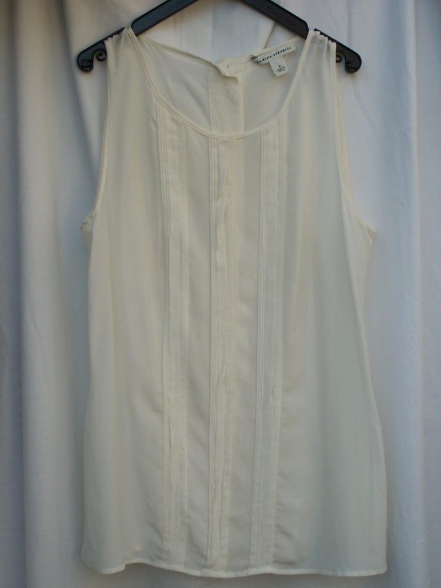 Preview of the first image of BANANA REPUBLIC Cream Silk Top – Size 6.