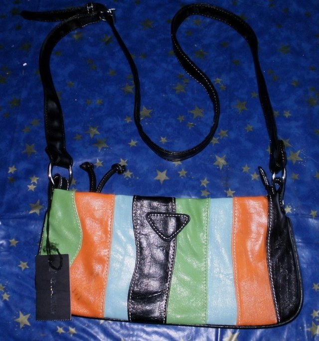 Preview of the first image of NEW HANDBAG FUNKY COLOURS SLIGHT MARK ON BAG.