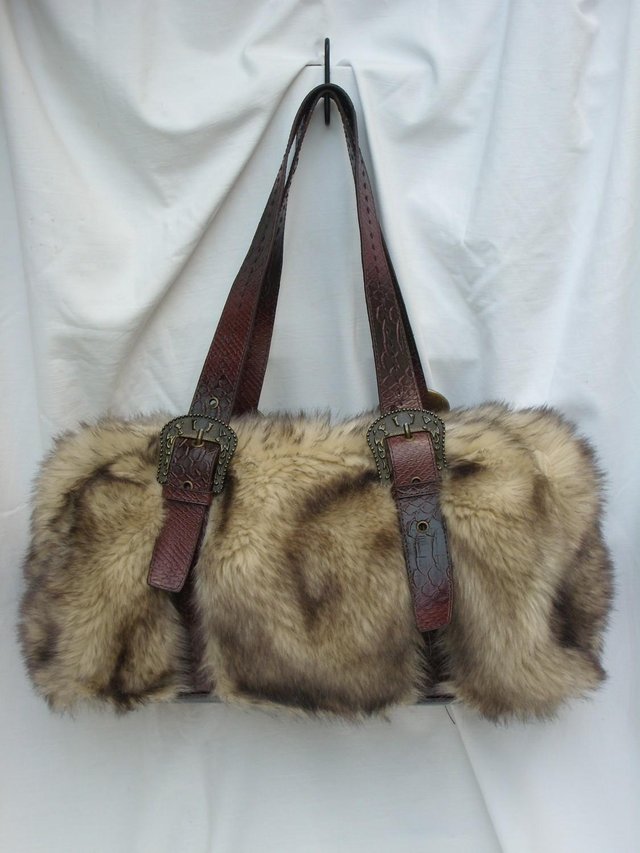 Preview of the first image of DENTS Brown Faux Furry Shoulder Handbag.