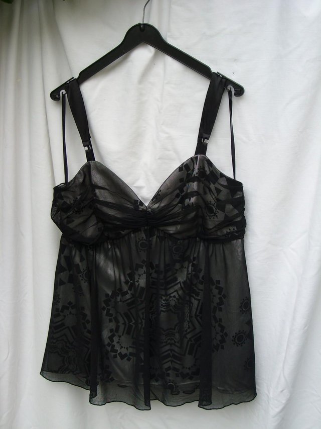 Preview of the first image of BRUNO BANANI Black Evening Top – Size 16.