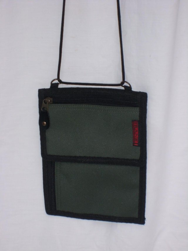 Preview of the first image of FRANK! Green Travel Wallet Handbag With Strap.
