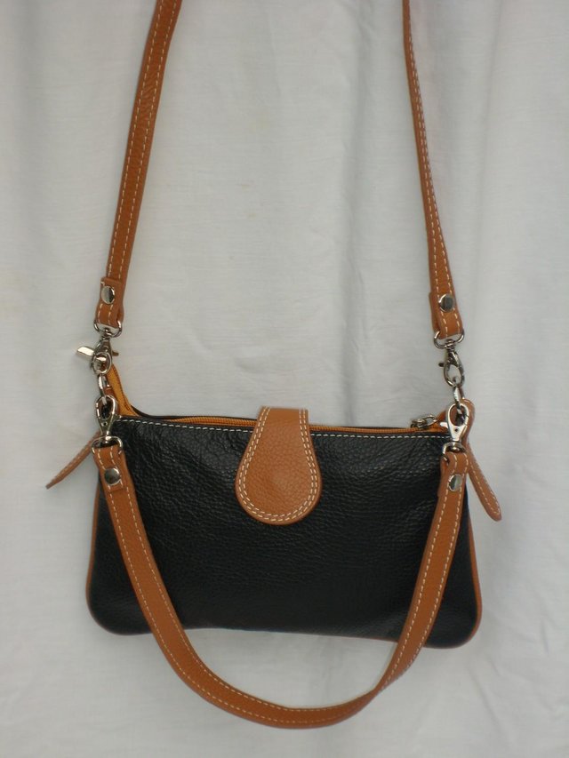 Preview of the first image of Black & Tan Leather Handbag NEW.