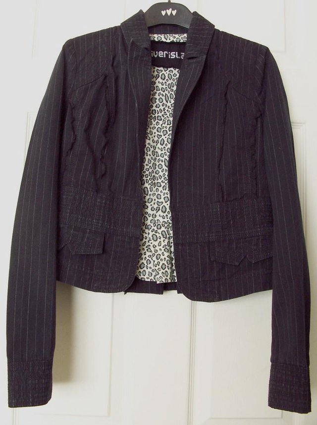 Preview of the first image of Lovely Short Style Pinstripe Jacket By River Island - Sz 12..