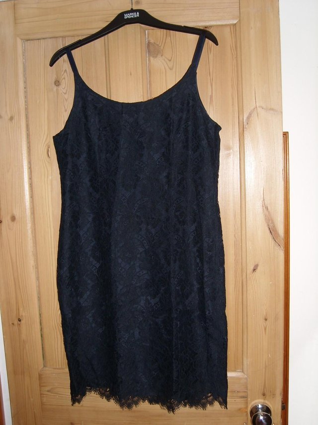 Preview of the first image of Cute Little Navy Lace Dress – Size 14.