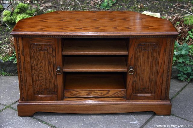 Preview of the first image of A JAYCEE OLD CHARM OAK CORNER TV HI FI DVD CD CABINET STAND.