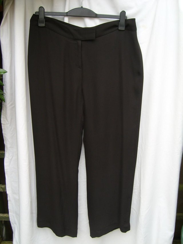Preview of the first image of FENN WRIGHT & MANSON Brown Silk Trousers – Size 16.