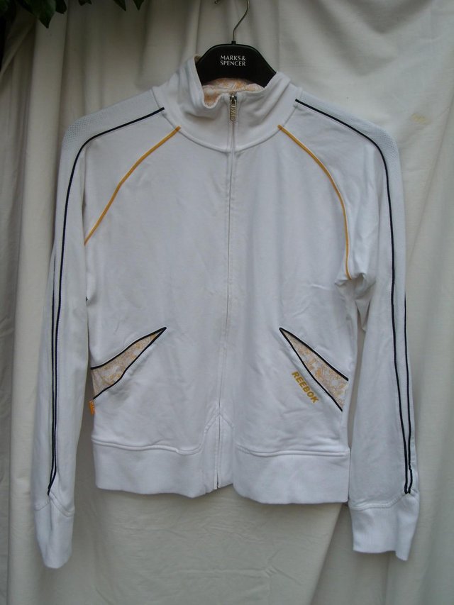 Preview of the first image of REEBOK GYM White Zip Front Sport Top – Size 18 - NEW.