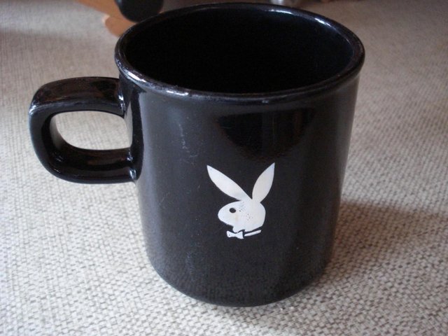 Preview of the first image of COLLECTORS MUG HUGH HEFNER PLAYBOY POTTERY DODO DESIGNS.