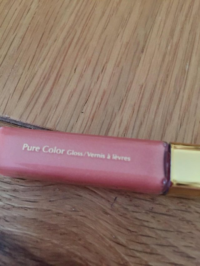 Preview of the first image of Genuine Estee Lauder LIP GLOSS gold/pink.