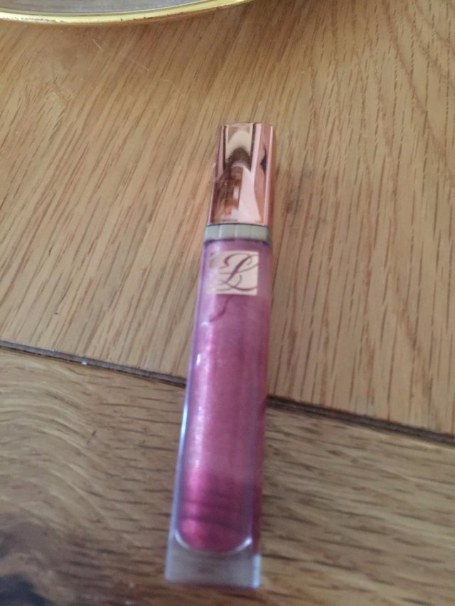 Preview of the first image of Genuine Estee Lauder LIP GLOSS  pink.