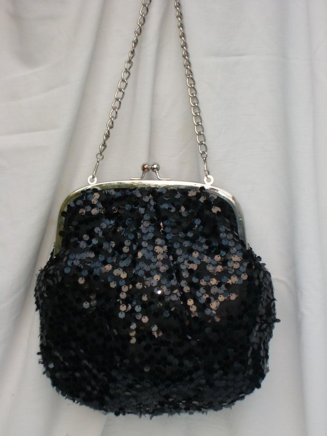 Preview of the first image of Large Black Sequin Snap Top Handbag.
