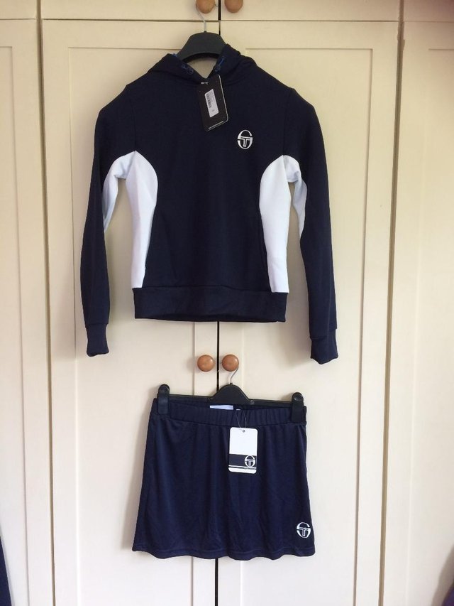 Preview of the first image of Sergio Tacchini Tennis Tracksuit Hoodie and Skort Size Small.