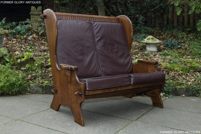 Preview of the first image of NIGEL RUPERT GRIFFITHS OAK LEATHER WING BACK SETTEE ARMCHAIR.