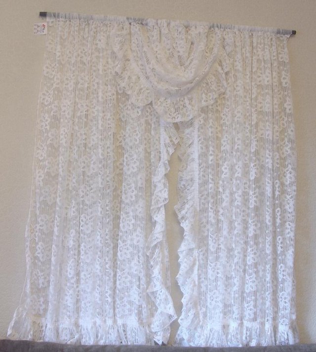 Preview of the first image of Pretty White All In One Net Curtain With Centre Swag.