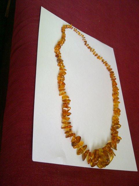 Preview of the first image of Amber pieces for sale. On silk twine..