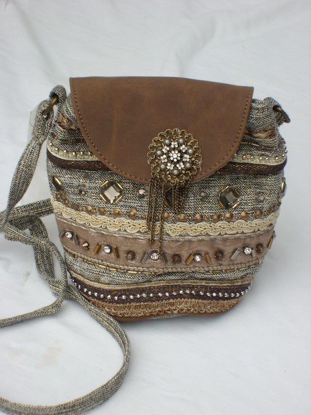 Preview of the first image of ACCESSORIZE Cross Body Brown/Gold Fabric Handbag NEW.