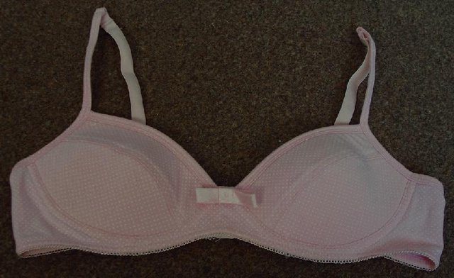 Preview of the first image of Pretty Ladies/Girls Pink Spotted Padded Bra - Sz 34A.