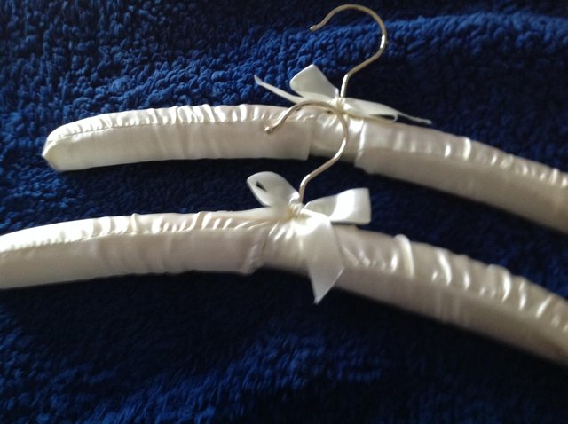 Preview of the first image of 2 SATIN coat hangers.