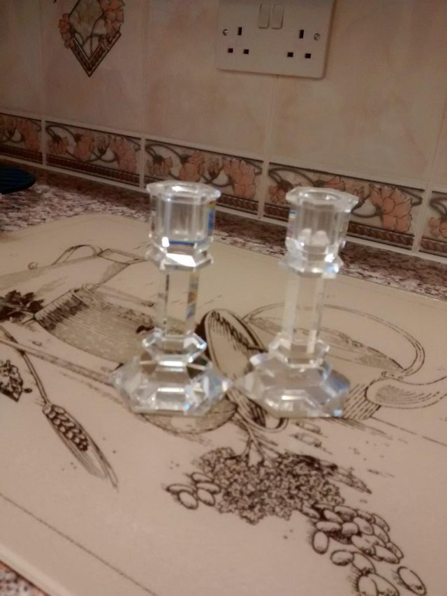 Preview of the first image of cut glass candle stick holders.