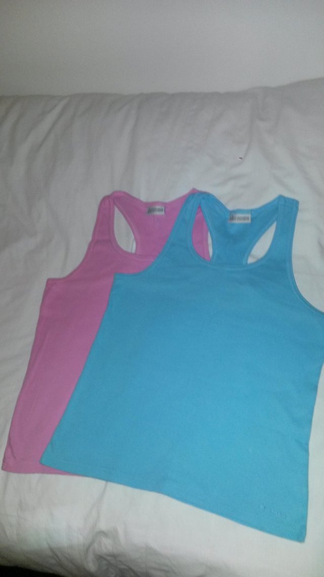 Preview of the first image of Ladies Olympus sports tops.