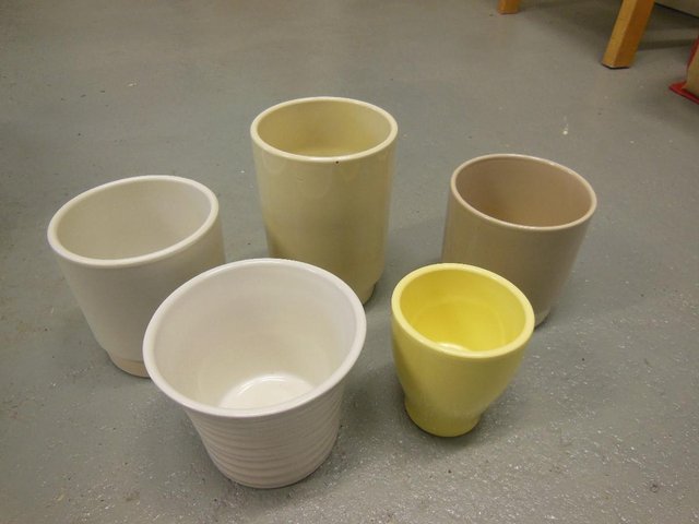 Preview of the first image of selection of 5 small plant pots.