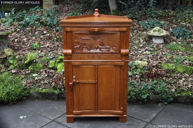 Preview of the first image of A NIGEL RUPERT GRIFFITHS OAK CORNER CABINET WINE CUPBOARD.