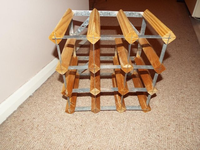 Preview of the first image of Nine bottle pine and steel wine rack.