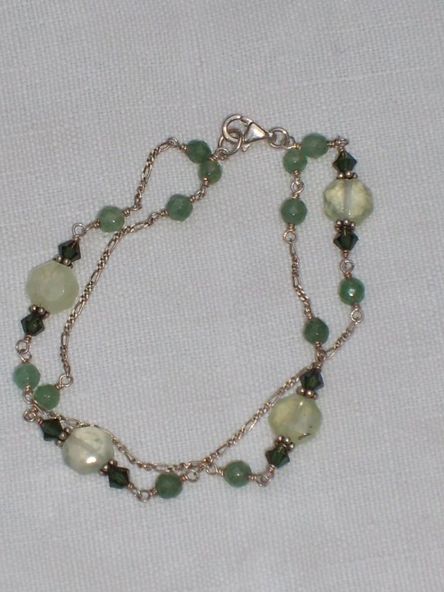 Preview of the first image of 925 Sterling Silver Bracelet With Green Beads.