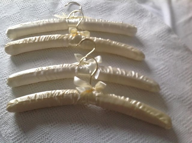 Preview of the first image of NEW SATIN COAT HANGERS SET of 4.