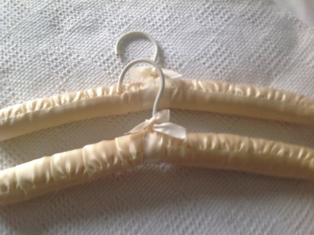 Preview of the first image of 2 NEW SATIN COAT HANGERS.