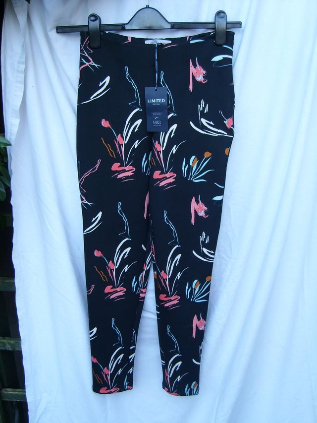 Preview of the first image of M&S LIMITED Black/Neon Print Trousers – Size 8 NEW!.
