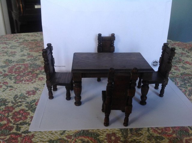 Preview of the first image of Dollhouse dining table and four chairs.