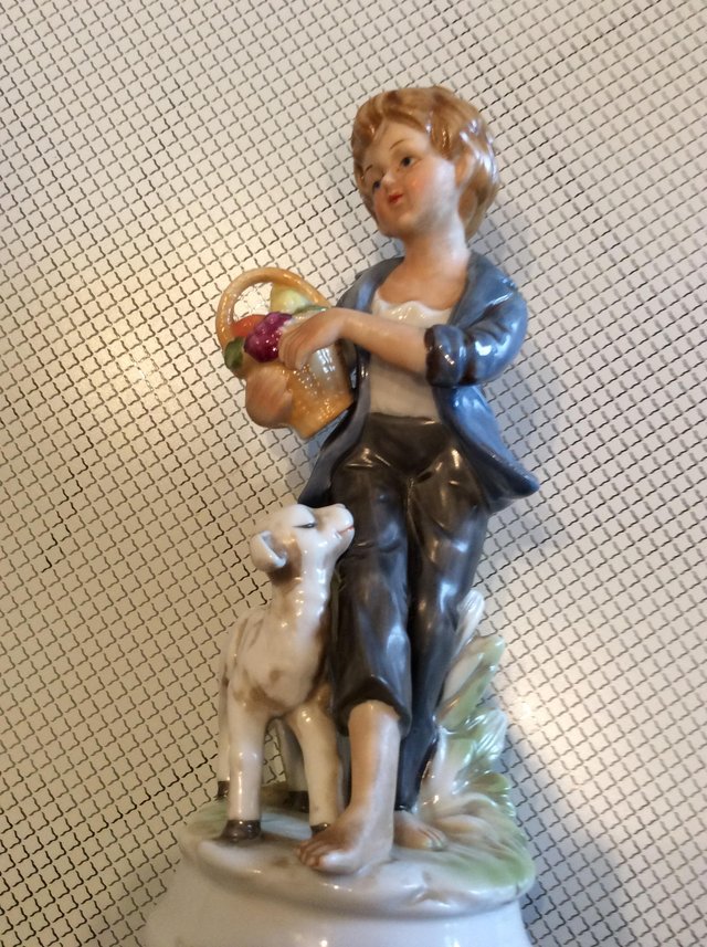 Preview of the first image of Antique porceline figurine of shepherd boy.