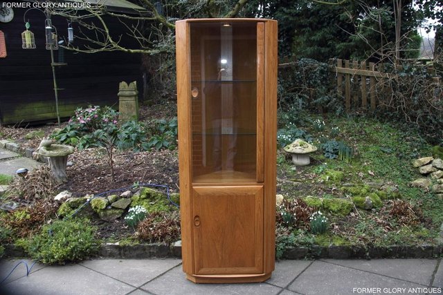 Preview of the first image of ERCOL WINDSOR LIGHT ELM CORNER DISPLAY CABINET CUPBOARD UNIT.