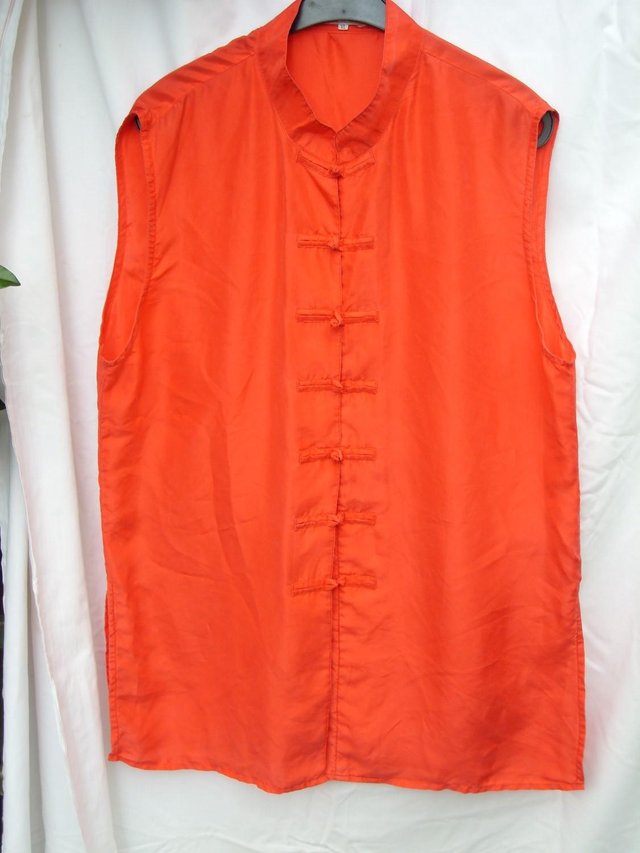 Preview of the first image of Sleeveless Chinese Style Red Silk Top – Size 14/16.