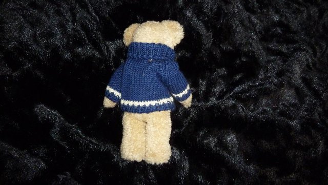 Preview of the first image of collectable JB BEAN vintage teddy bear in Christmas jumper.