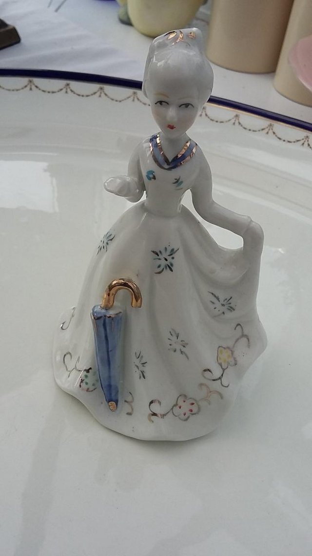 Preview of the first image of Vintage Victorian Lady Porcelain Figurine Bell Blue Umbrella.