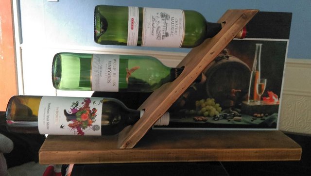 Preview of the first image of Counter weighted Three Bottle Wine holder.