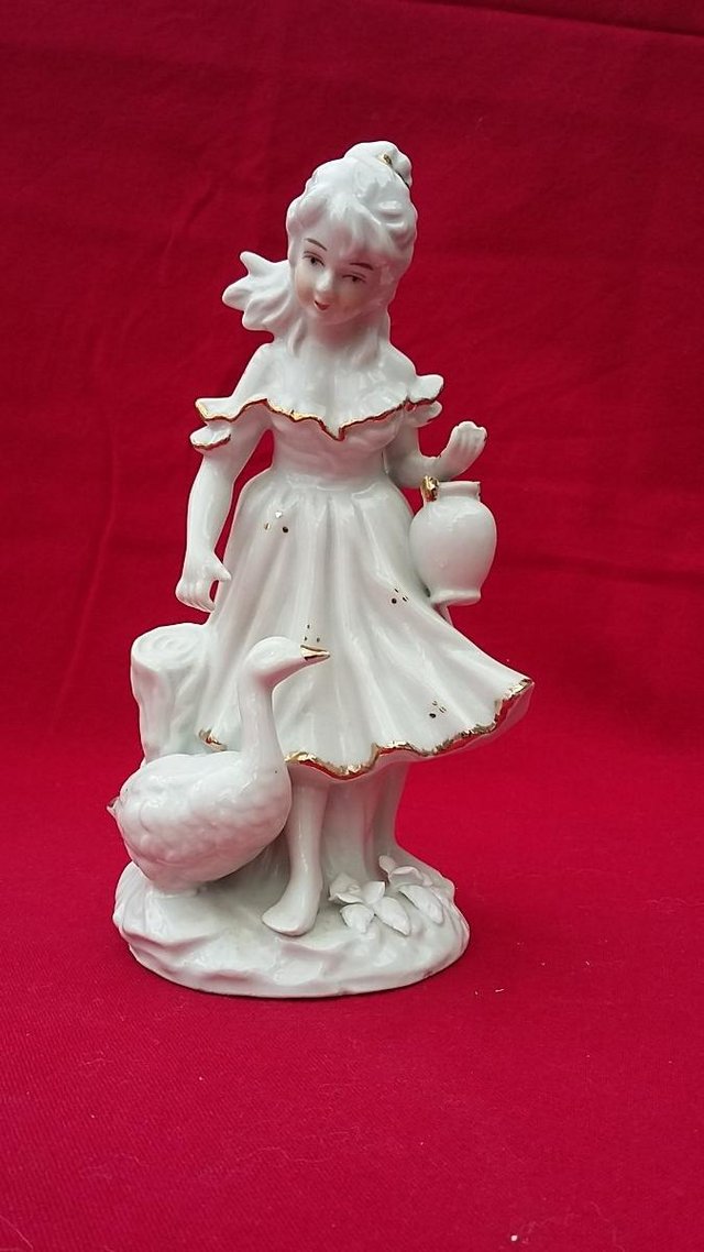 Preview of the first image of Vintage Porcelain Girl With Goose Figurines White With Gold.