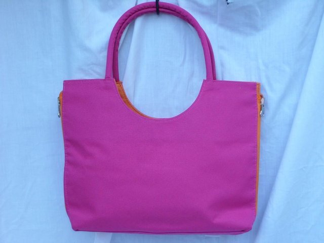 Preview of the first image of EVAX Reversible Neon Pink/Orange Grab Bag NEW.