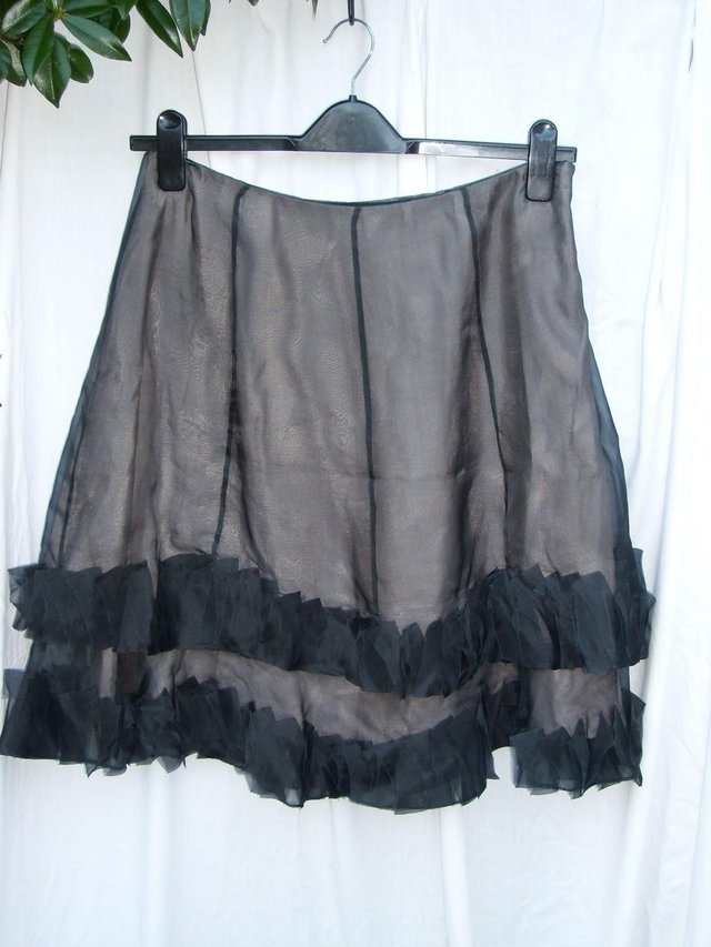 Preview of the first image of COAST Grey Silk Chiffon Ruffle Skirt - Size 12.