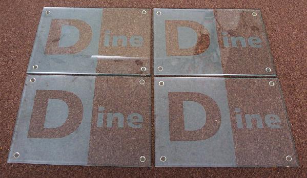 Preview of the first image of Set Of 4 "Dine" Glass Place Mats.     BX19.