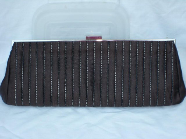 Preview of the first image of ACCESSORIZE Brown Satin Clutch Bag.