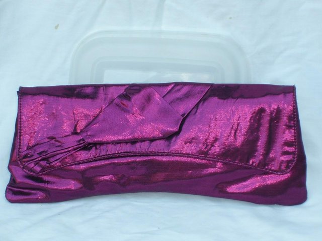 Preview of the first image of OASIS Metallic Pink Clutch Bag.